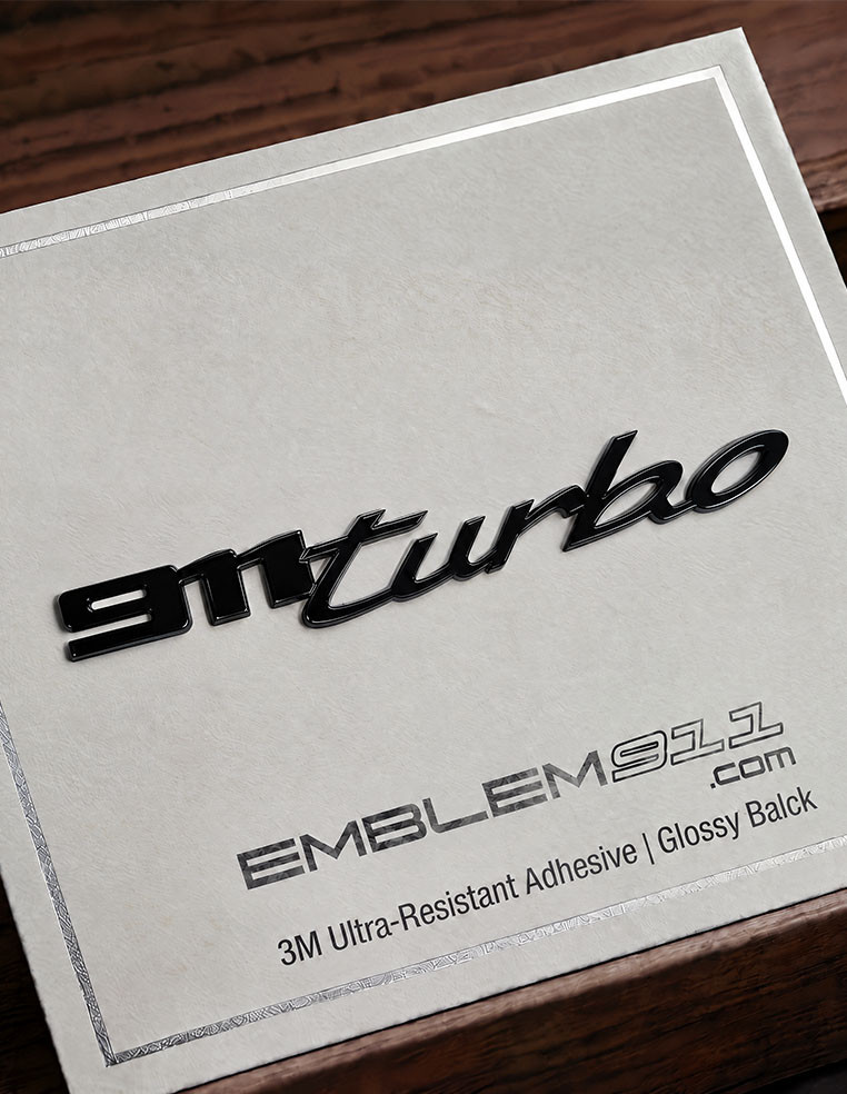 logo emblème porsche 911 Turbo 992 noir brillant